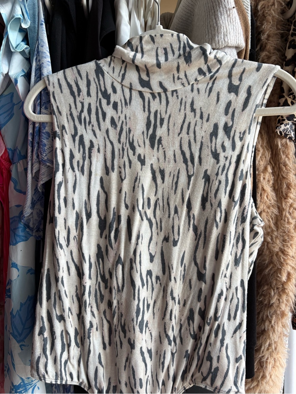 Express Sleeveless Turtleneck Tank in Beige and Black Animal Print